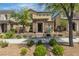Charming two-story home with a stone-accented entrance and well-maintained landscaping at 2116 Via Firenze, Henderson, NV 89044