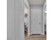 Hallway includes a door for washer and dryer hookups and a door to a half-bath at 2116 Via Firenze, Henderson, NV 89044