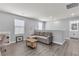 Bright living room with sofa, coffee table, and adjacent bathroom, designed for comfort and convenience at 2116 Via Firenze, Henderson, NV 89044