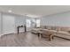 Bright and airy living room showcasing a large comfortable sofa and contemporary decor at 2116 Via Firenze, Henderson, NV 89044