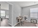 Bright office space featuring a desk and chair near a window, offering a functional and inviting workspace at 2116 Via Firenze, Henderson, NV 89044