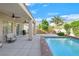 Charming backyard with a pool, patio, mature trees, and plenty of space for entertaining at 2132 Twin Falls Dr, Henderson, NV 89044
