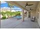 Relaxing backyard features a pool, a covered patio, and outdoor seating area at 2132 Twin Falls Dr, Henderson, NV 89044