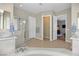 Bathroom featuring walk-in shower, dual sink vanity, a toilet room and an entrance to main bedroom at 2132 Twin Falls Dr, Henderson, NV 89044