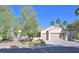 Charming single-story home with a three-car garage and well-maintained landscaping at 2132 Twin Falls Dr, Henderson, NV 89044