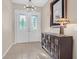 Inviting foyer with decorative double doors, stylish lighting, and elegant tiled flooring at 2132 Twin Falls Dr, Henderson, NV 89044