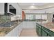 Open kitchen design with granite countertops and sleek appliances for modern cooking at 2132 Twin Falls Dr, Henderson, NV 89044