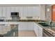Well-lit kitchen boasts granite countertops and modern stainless steel appliances at 2132 Twin Falls Dr, Henderson, NV 89044