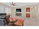 Cozy living room with plantation shutters, ceiling fan, and tiled floors at 2132 Twin Falls Dr, Henderson, NV 89044