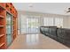Bright living space features a wall of custom shelving and access to the backyard at 2132 Twin Falls Dr, Henderson, NV 89044