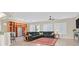 Large living room featuring a ceiling fan, built-in shelving, and tile flooring at 2132 Twin Falls Dr, Henderson, NV 89044