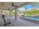 Covered patio featuring ceiling fans, and an outdoor seating area with views of the backyard and pool at 2132 Twin Falls Dr, Henderson, NV 89044