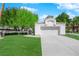 Well-maintained single-story home featuring a lush green lawn and a two-car garage at 240 Windsong Dr, Henderson, NV 89074