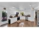 Bright and airy kitchen features hardwood flooring, granite countertops, and white cabinetry at 240 Windsong Dr, Henderson, NV 89074