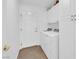 Functional laundry area equipped with modern appliances and ample storage cabinets at 240 Windsong Dr, Henderson, NV 89074
