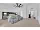 Spacious main bedroom featuring contemporary decor, seating area, ceiling fan and ensuite access at 240 Windsong Dr, Henderson, NV 89074