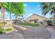 Spacious backyard showcasing mature palm trees, rock landscaping, and a covered patio area at 2514 Tropical Sands Ave, North Las Vegas, NV 89031