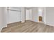 Bedroom with wood-look laminate flooring and entry to ensuite bathroom at 2514 Tropical Sands Ave, North Las Vegas, NV 89031