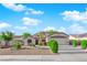 Charming single-story home featuring desert landscaping, a two-car garage, and a well-maintained lawn at 2514 Tropical Sands Ave, North Las Vegas, NV 89031