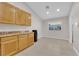 Bright kitchen with a window, light-colored wood cabinets, granite countertops, and stainless steel appliances at 2514 Tropical Sands Ave, North Las Vegas, NV 89031