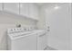 Laundry room with washer, dryer and extra storage cabinets at 2514 Tropical Sands Ave, North Las Vegas, NV 89031