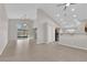 Open-concept living room features tile flooring, sliding glass doors, a barn door, and lots of natural light at 2514 Tropical Sands Ave, North Las Vegas, NV 89031