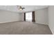 Large bedroom with plush carpet, recessed lighting, ceiling fan, and large window with decorative curtains at 2595 Aviv Ct, Las Vegas, NV 89121