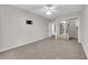 Bedroom featuring a mirrored closet, ceiling fan, neutral carpet, and balcony access at 2595 Aviv Ct, Las Vegas, NV 89121