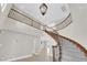 Open entryway featuring a staircase, high ceilings, and wood and iron railings at 2595 Aviv Ct, Las Vegas, NV 89121