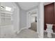 Hallway featuring a walk-in closet and a peek into a bathroom and bonus room at 2595 Aviv Ct, Las Vegas, NV 89121