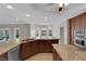 Spacious kitchen featuring double basin sink, granite countertops, wood cabinets, and stainless appliances at 2595 Aviv Ct, Las Vegas, NV 89121