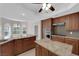 Well-appointed kitchen featuring granite countertops, a convenient island, and a breakfast nook at 2595 Aviv Ct, Las Vegas, NV 89121