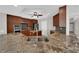 Gourmet kitchen featuring a large island, stainless appliances, and granite countertops at 2595 Aviv Ct, Las Vegas, NV 89121
