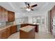 Gourmet kitchen features a large island, granite countertops and stainless steel appliances at 2595 Aviv Ct, Las Vegas, NV 89121