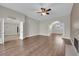 Large living room featuring hardwood floors, fireplace, and views into other rooms of the home at 2595 Aviv Ct, Las Vegas, NV 89121
