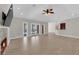 Large living room features tile flooring, fan, and access to the outdoor space at 2595 Aviv Ct, Las Vegas, NV 89121