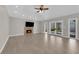 Spacious living room with fireplace and access to the outdoor pool at 2595 Aviv Ct, Las Vegas, NV 89121