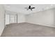 Expansive living room featuring neutral carpet, recessed lighting, and a ceiling fan at 2595 Aviv Ct, Las Vegas, NV 89121