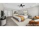 Relaxing primary bedroom is virtually staged and features sitting area, ensuite bath, and walk in closet at 2595 Aviv Ct, Las Vegas, NV 89121