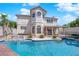 Inviting backyard pool and spa with rock accents and lush landscaping at 2595 Aviv Ct, Las Vegas, NV 89121