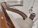 View of curved staircase with wooden handrail and iron balusters, and tiled floor at 2595 Aviv Ct, Las Vegas, NV 89121