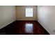 Bright bedroom featuring wood flooring and a window letting in plenty of natural light at 2606 S Durango Dr # 171, Las Vegas, NV 89117