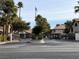 Gated community entrance with a tile roofed building in the background, enhancing privacy and security at 2606 S Durango Dr # 171, Las Vegas, NV 89117