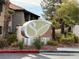 Symphony community sign with lush landscaping and palm trees at the entrance to the neighborhood at 2606 S Durango Dr # 171, Las Vegas, NV 89117