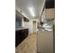 Functional kitchen features tiled floors and white appliances at 2606 S Durango Dr # 171, Las Vegas, NV 89117