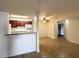 Living room featuring new wood flooring and an open kitchen at 2606 S Durango Dr # 171, Las Vegas, NV 89117