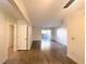Open-concept living room with wood floors and balcony access at 2606 S Durango Dr # 171, Las Vegas, NV 89117