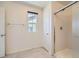 Clean bathroom features a glass-enclosed shower and tile flooring at 2862 Starling Summit St, Henderson, NV 89044