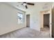 Well-lit bedroom with carpet flooring, window, and closet for ample storage at 2862 Starling Summit St, Henderson, NV 89044
