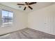 Cozy bedroom with neutral carpet and ceiling fan provides a calm atmosphere at 2862 Starling Summit St, Henderson, NV 89044